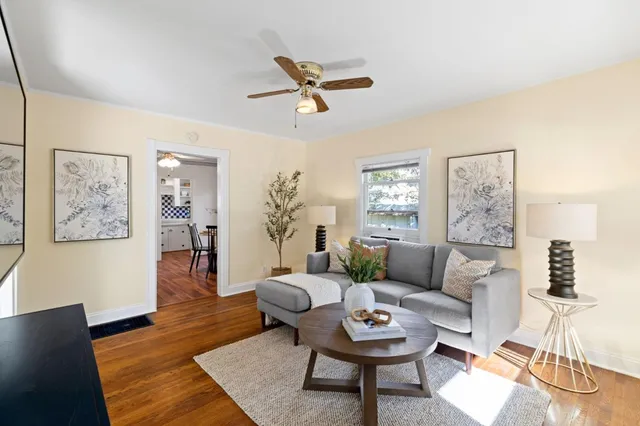 a living room with furniture and a fireplace