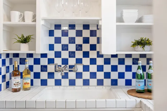 a dining room with furniture a chandelier and wooden floor