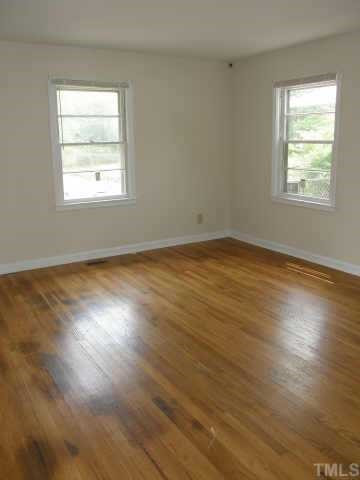 912 Devonport Drive Raleigh, NC 27610 - Photo 3 of 12 This large living room is full of natural light from three sides. The hardwoods are in great shape, and would look beautiful with a warm taupe on the walls. Other