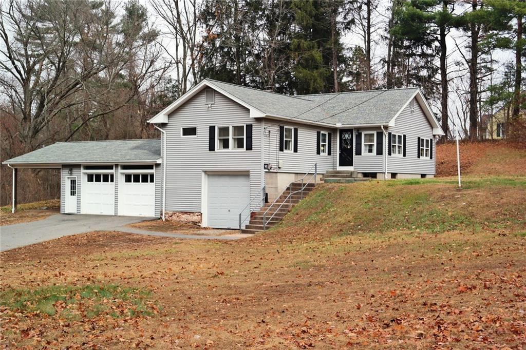 141 Hampden Road Somers, CT 06071 - Photo 1 of 1 a white house that has a tree in front of it