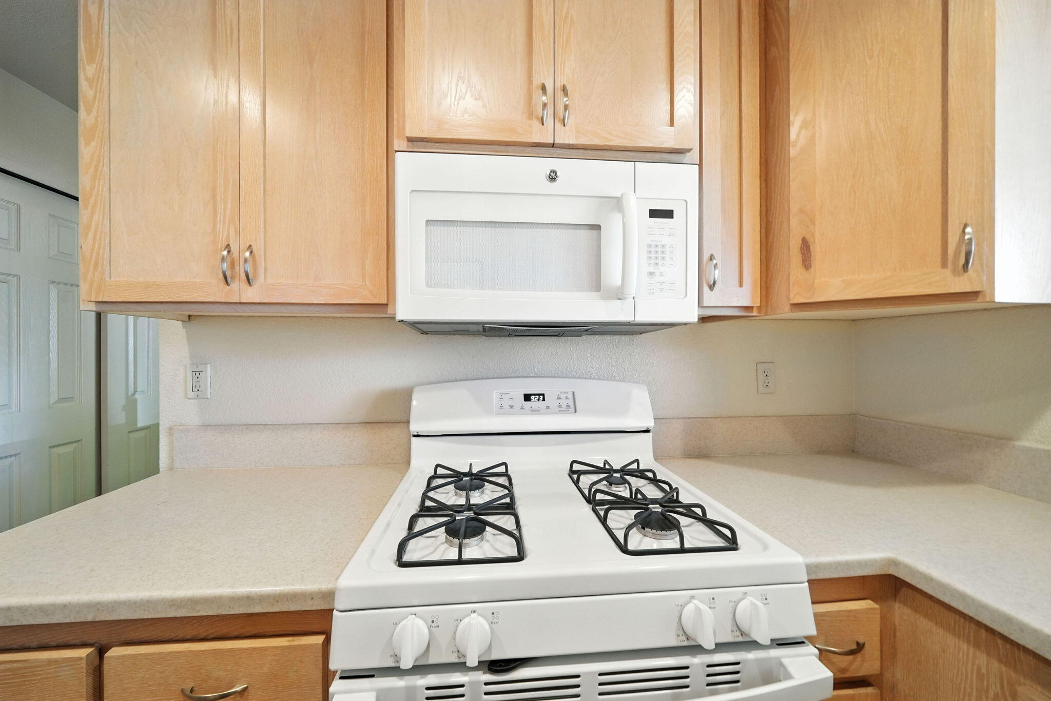 810 Ashmount Avenue Red Bluff, CA 96080 - Photo 12 of 21 a kitchen with white cabinets and white appliances