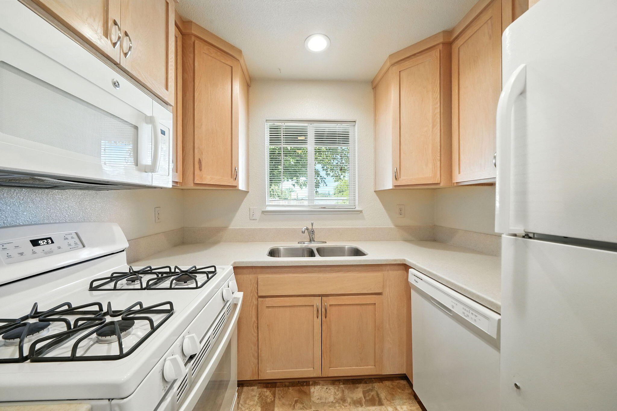 810 Ashmount Avenue Red Bluff, CA 96080 - Photo 13 of 21 a kitchen with a white stove top oven and sink