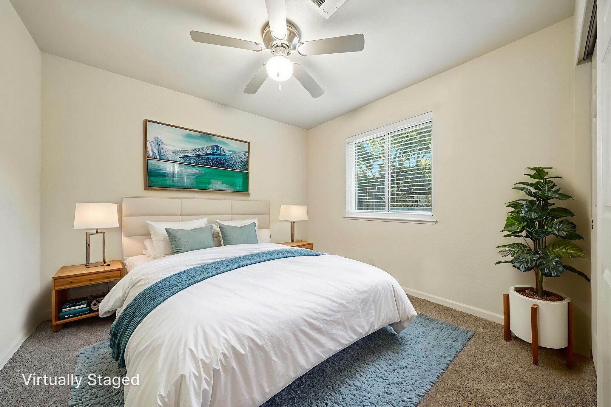 810 Ashmount Avenue Red Bluff, CA 96080 - Photo 17 of 21 a bedroom with a bed and a potted plant