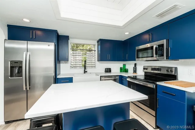 a living room with a couch and a fireplace