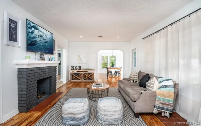 a living room with furniture and a fireplace