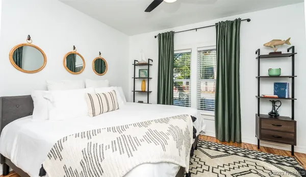a dining room with wooden floor and a table