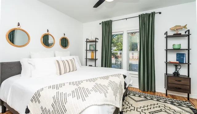 a dining room with wooden floor and a table