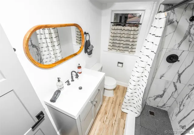 a room with pool table and window