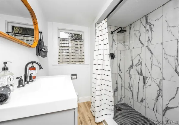 a reading room with furniture and a window