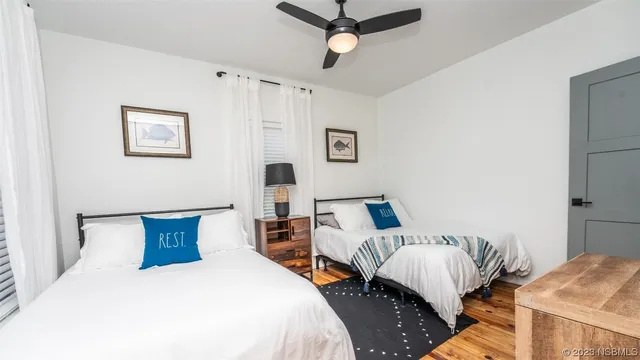 a view of a house with backyard sitting area and garden