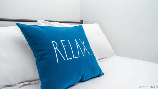 a view of a backyard with sitting area