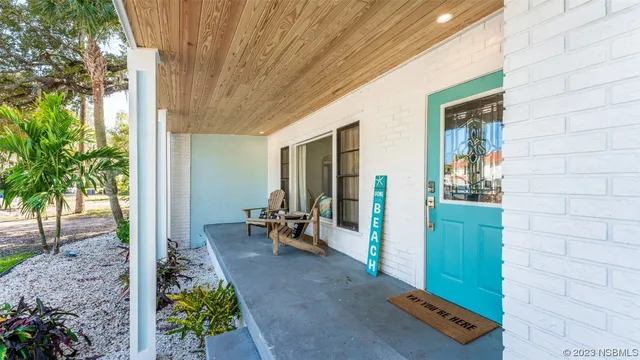 a view of a lobby with chair and floor to ceiling window