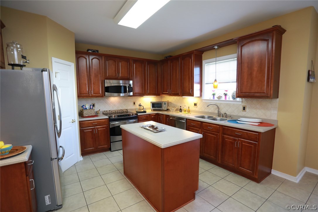 3006 Burley Ridge Terrace Chester, VA 23831 - Photo 13 of 37 a kitchen with stainless steel appliances granite countertop a sink stove refrigerator and a window