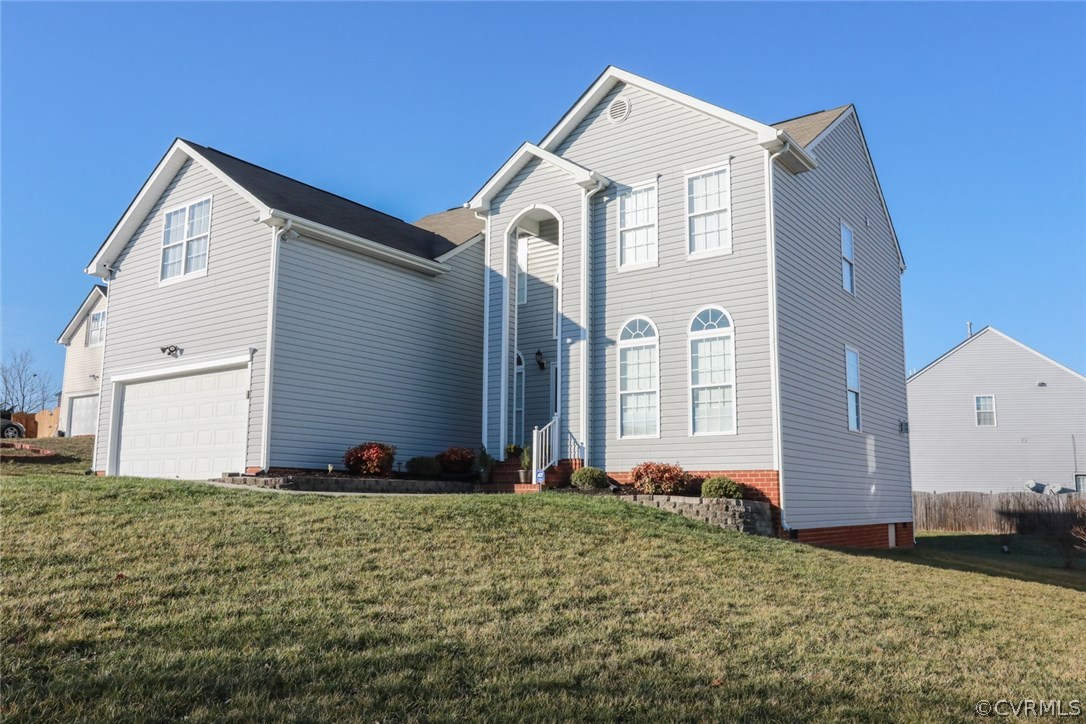 3006 Burley Ridge Terrace Chester, VA 23831 - Photo 2 of 37 a front view of a house with a yard