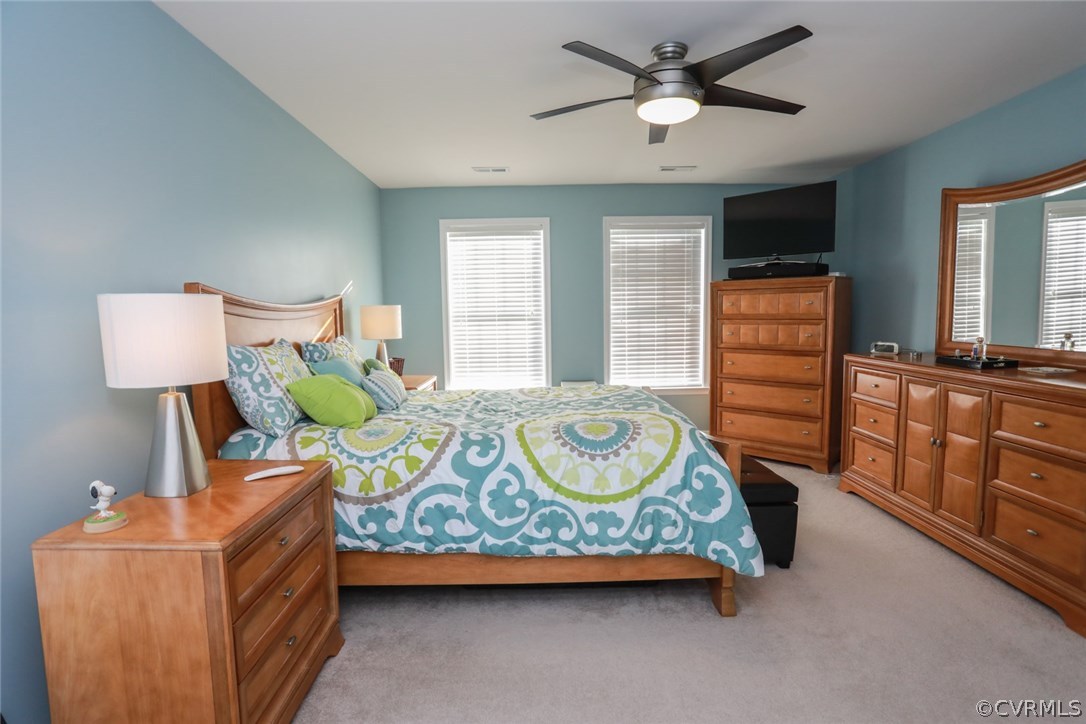 3006 Burley Ridge Terrace Chester, VA 23831 - Photo 23 of 37 a bedroom with a bed and wooden floor