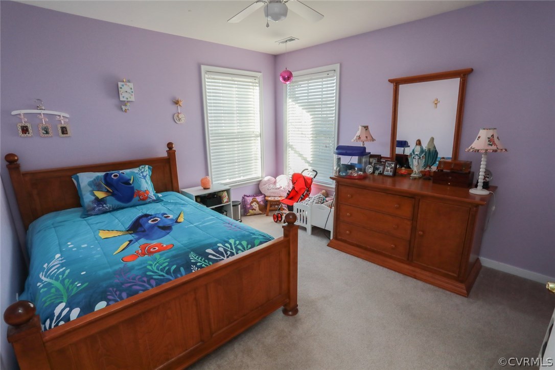 3006 Burley Ridge Terrace Chester, VA 23831 - Photo 25 of 37 a bedroom with a bed table closet and a window
