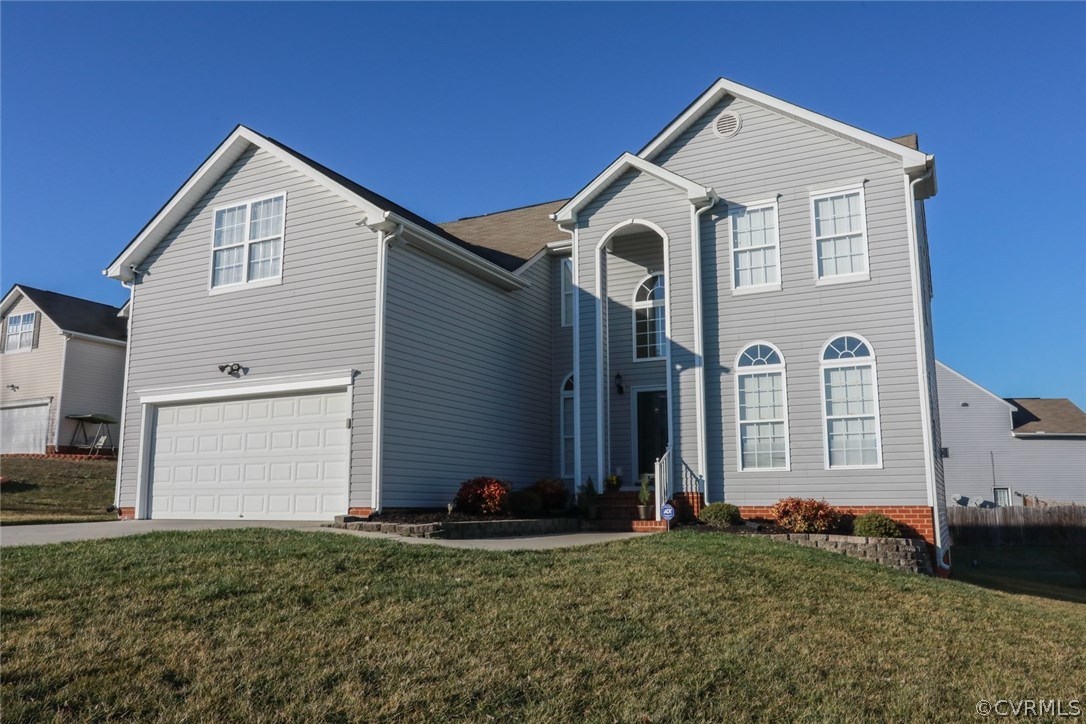 3006 Burley Ridge Terrace Chester, VA 23831 - Photo 31 of 37 a front view of a house with a yard