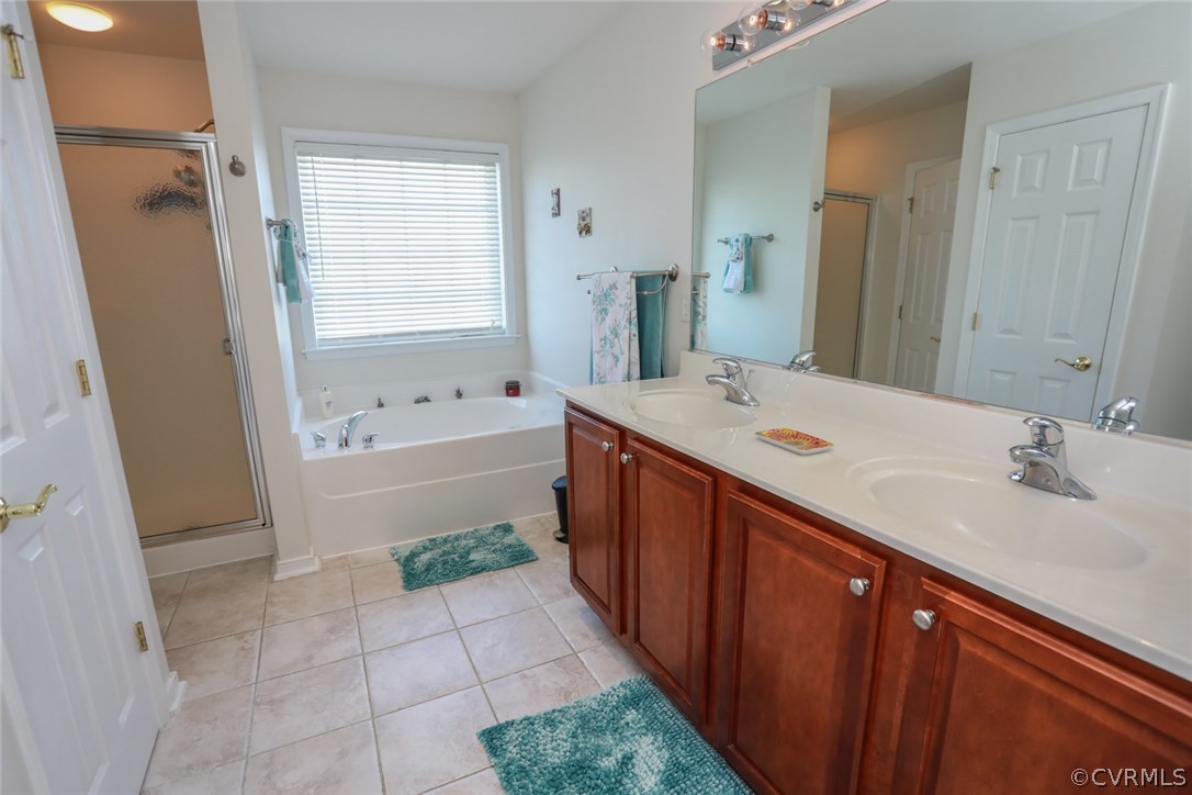 3006 Burley Ridge Terrace Chester, VA 23831 - Photo 7 of 37 a spacious bathroom with a tub sink and mirror