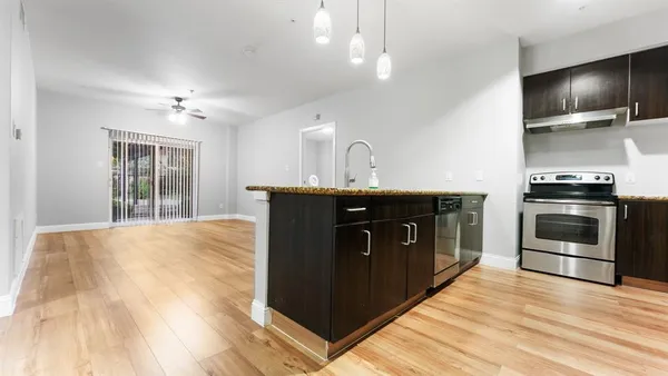 a kitchen with a stove and a sink