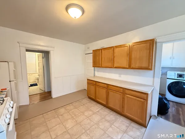a kitchen with a sink and a stove top oven