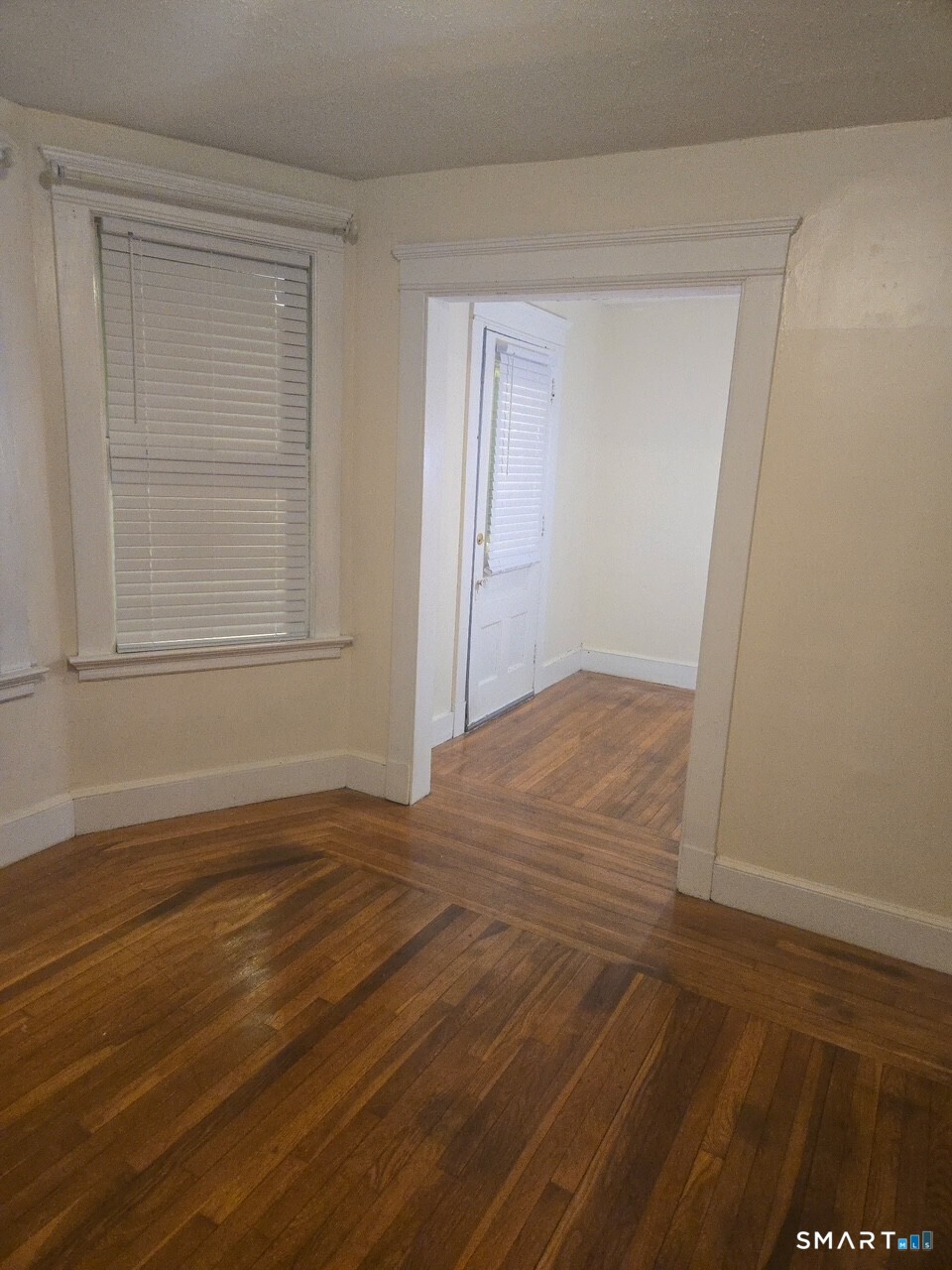 867 Elm Street New Haven, CT 06511 - Photo 15 of 20 a view of an empty room with wooden floor and a window