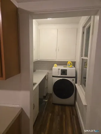 a utility room with dryer and washer