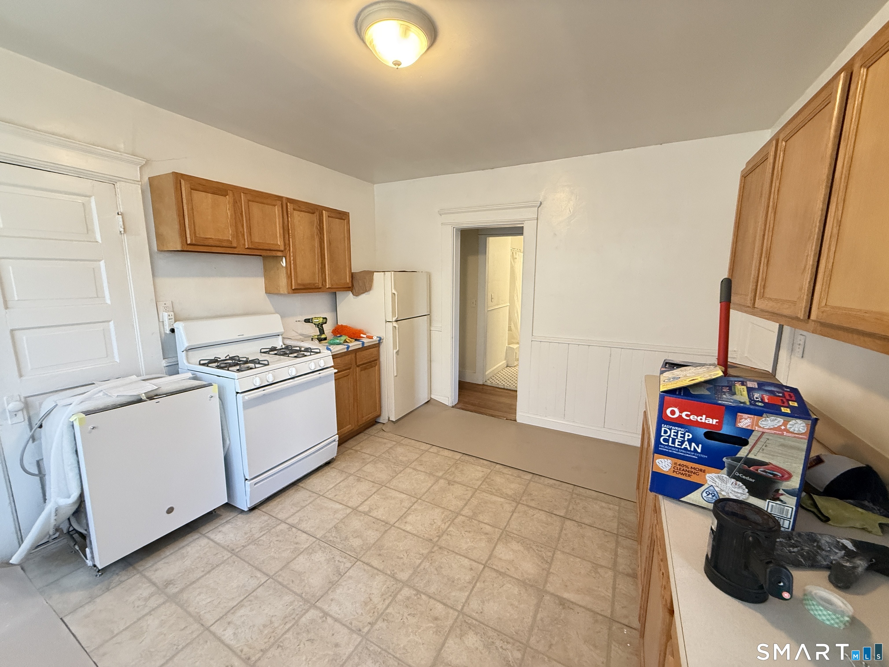 867 Elm Street New Haven, CT 06511 - Photo 10 of 20 a kitchen with a cabinets and white appliances