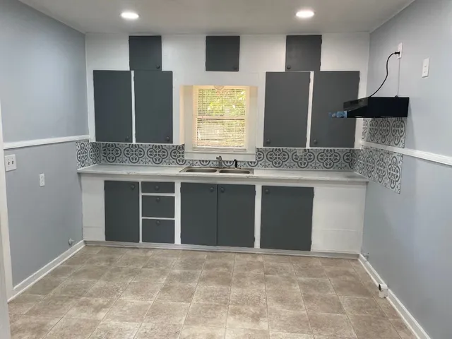 a kitchen with stainless steel appliances granite countertop a stove and a refrigerator