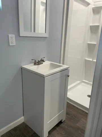 a utility room with sink dryer and washer
