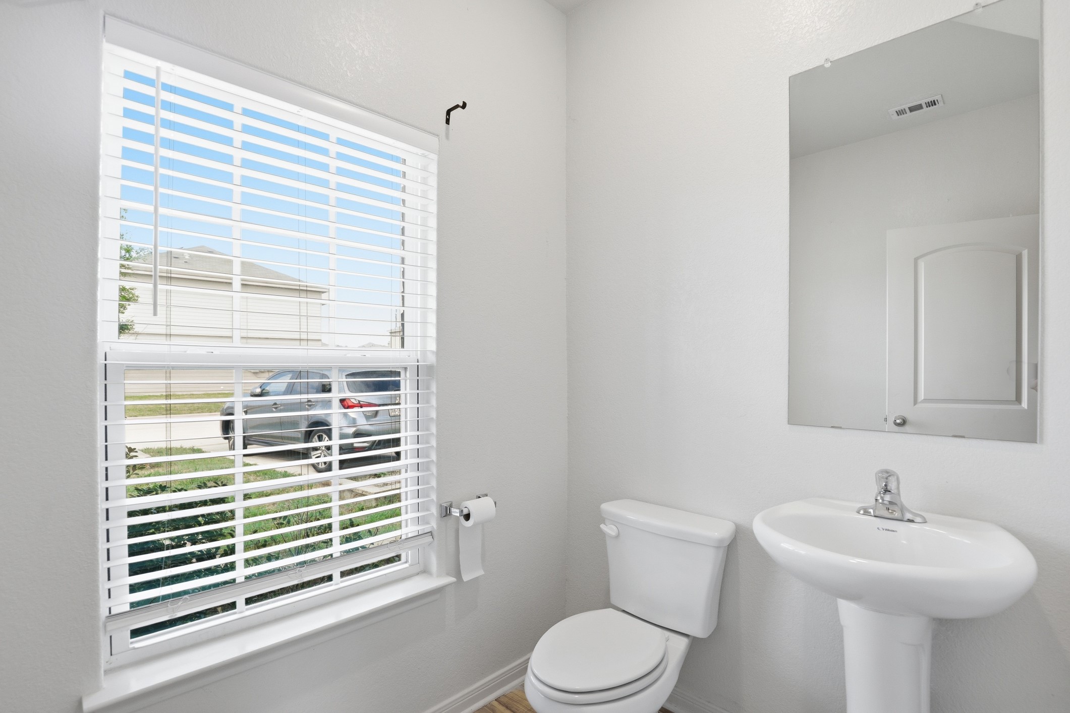 300 Hyacinth Way Jarrell, TX 76537 - Photo 17 of 37 a bathroom with a sink a toilet and a window