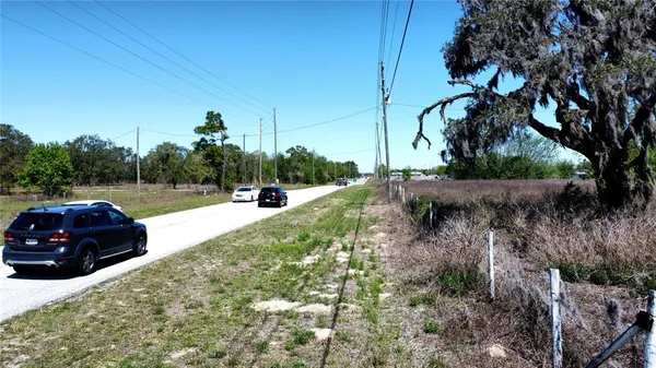 a view of a car parked on the side of the road
