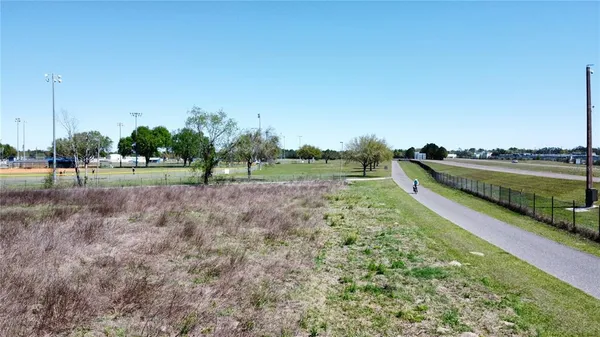 a view of a golf course with a lake