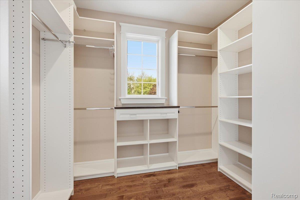 35339 West 13 Mile Road Farmington, MI 48331 - Photo 25 of 72 Primary walk in closet featuring dark wood-type flooring