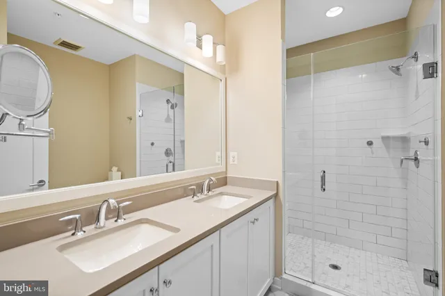 a bedroom with a bed and cupboard