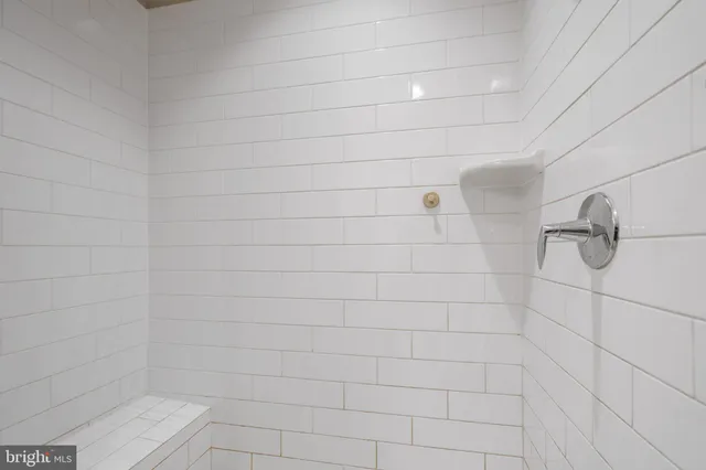 a bedroom with furniture and a flat screen tv