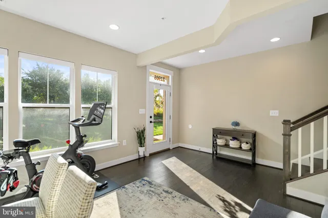 a view of a lake with couches in patio