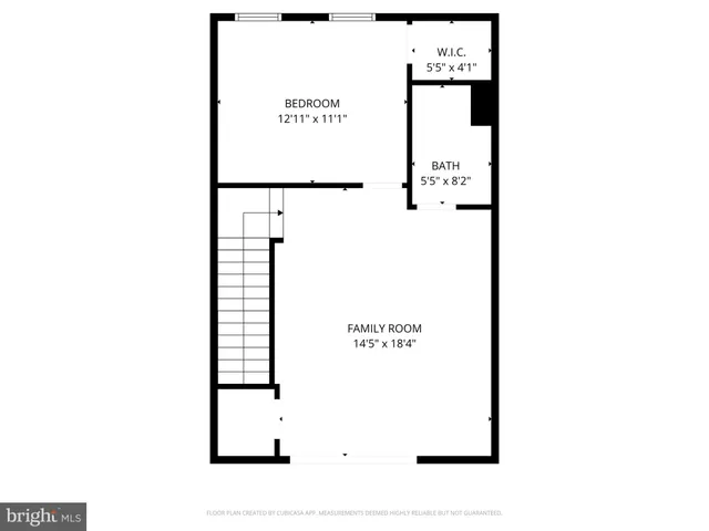 a picture of a bench in front of a wall