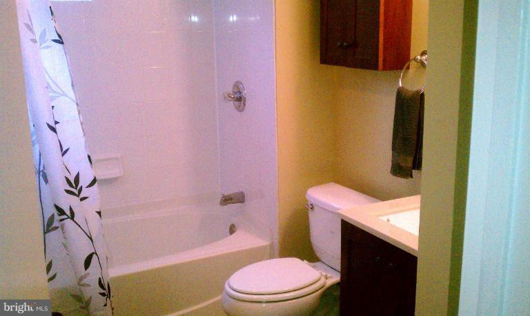 12501 Goodhill Road Silver Spring, MD 20906 - Photo 3 of 12 a white toilet sitting next to a bath tub