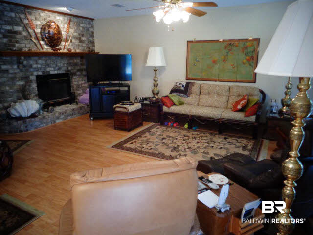 2804 Pine Ridge Drive Lillian, AL 36549 - Photo 9 of 39 Laminate wood look floor. Ceiling fan/light. Sliding door to screened porch. Door has a rolling storm shutter, 2014.