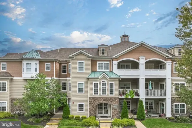 a front view of a large residential apartment building