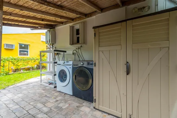 a utility room with dryer and washer