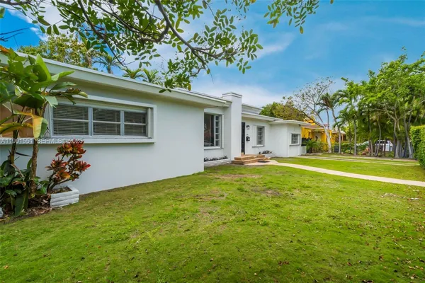 a house view with a garden space