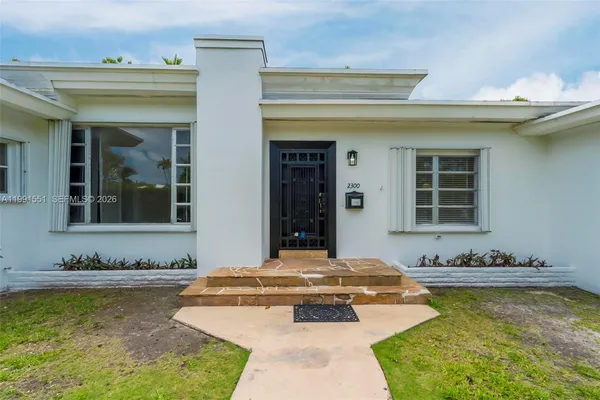 a swimming pool with outdoor seating