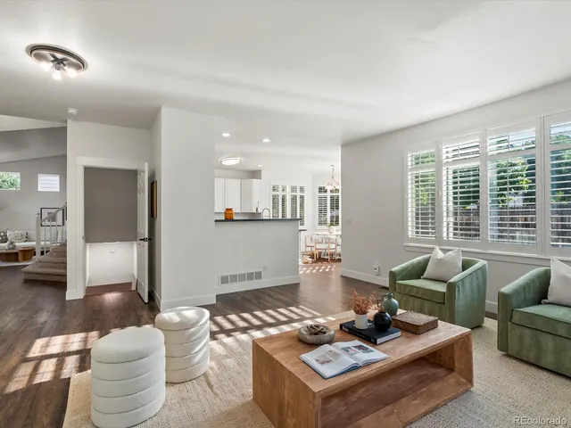 a bathroom with a toilet a sink and a mirror