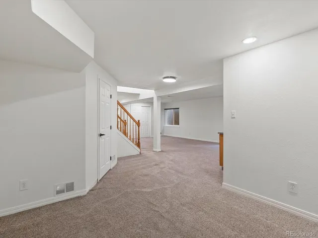 an aerial view of a house with a yard and garden