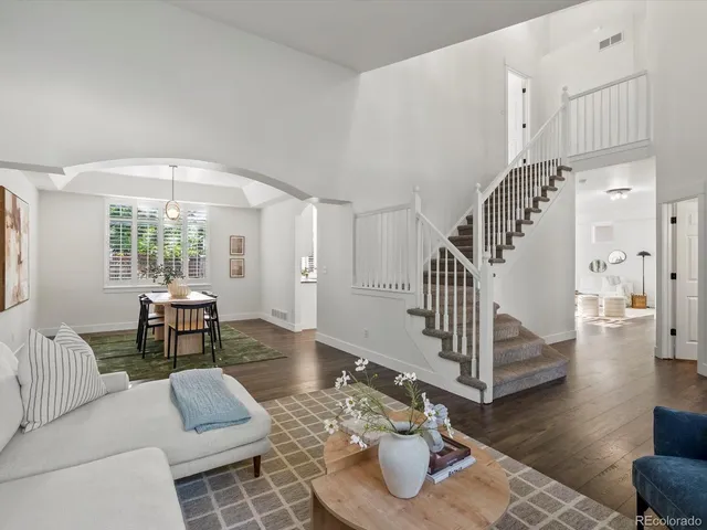 a kitchen with stainless steel appliances granite countertop a sink and wooden cabinets