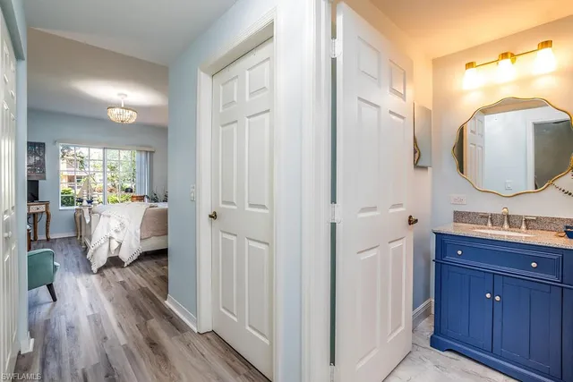 a spacious bathroom with a double vanity sink and a mirror