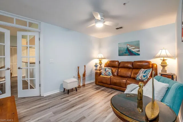a living room with furniture and a table