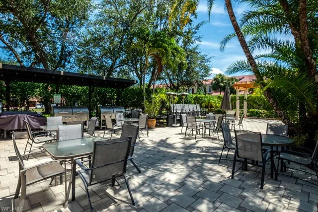 a view of chairs and tables in a patio