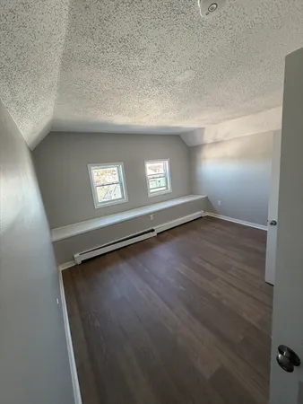 a view of an empty room with windows